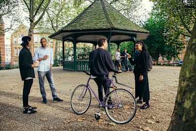 The Sanctus team encourage people to discuss their mental health in a park in London.