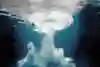 The underwater 'bombhole' left by a high diver as they hit the water.