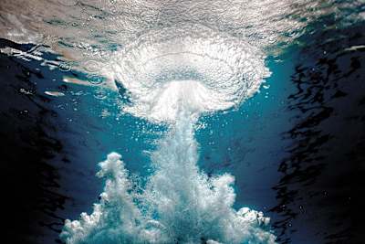 The underwater 'bombhole' left by a high diver as they hit the water.
