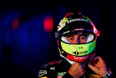 Checo Strapping On His Helmet