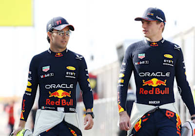 Sergio Pérez and Max Verstappen of the Oracle Red Bull Racing team talk during day one of F1 Testing at Bahrain International Circuit on February 23, 2023.