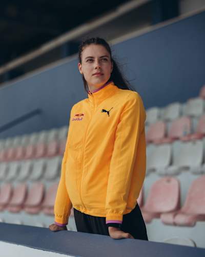 Yaroslava Mahuchikh sports a vibrant Red Bull jacket at Monte Gordo stadium in Portugal, captured on June 9, 2025, radiating athletic energy and style for the 2025 season.