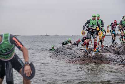 Participants take part in the Otillo swim run world champs in Sweden.