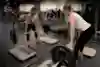 Demonstration of how to lower the barbell after a deadlift.