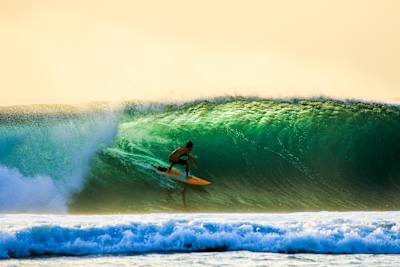 Rizal Tandjung rides the tube at Desert Point, Lombok, Indonesia.