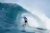 Surfer Sheldon Paishon rides the tube at Backdoor Pipeline.