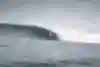 Professional big wave surfer from South Africa, Grant 'Twiggy' Baker, pulls into a barrel at the Basque Country surf break, Roka Puta.