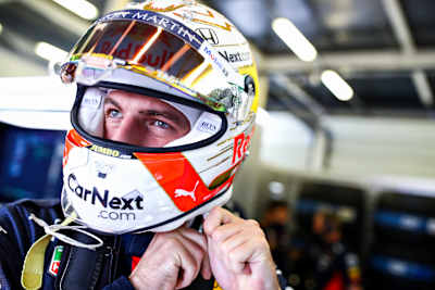 Max Tightens His Helmet
