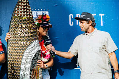Molly Picklum talks to Kaipo Guerrero after winning the Hurley Pro Sunset Beach in Hawaii on February 19, 2023. 