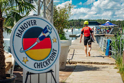 A team member heads for a wakeboarding challenge at the Red Bull Can You Make It? checkpoint in Hanover, Germany on May 26, 2024.