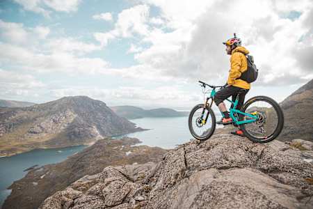 Danny Macaskill looking across water from Dubh Slabs, Isle of Skye