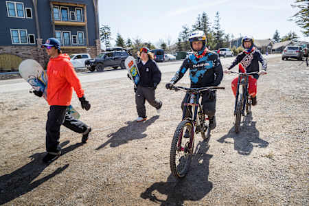 Snowboarders Luke Winklemann and Sean Fitzsimons, and mountain bikers Jaxson Riddle and Carson Storch in Snowshoe, US.