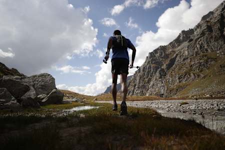 Kieren D'Souza runs by a stream on his way to scaling Mount Deo Tibba in the Himalayas.