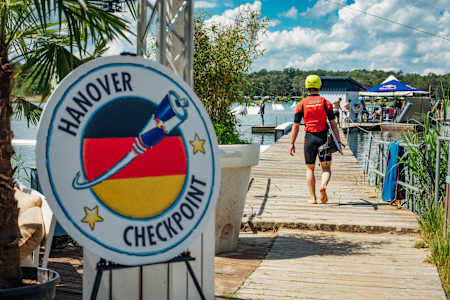 A team member heads for a wakeboarding challenge at the Red Bull Can You Make It? checkpoint in Hanover, Germany on May 26, 2024.