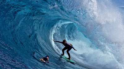 Lizzie Stokely surfing at Shipstern Bluff.