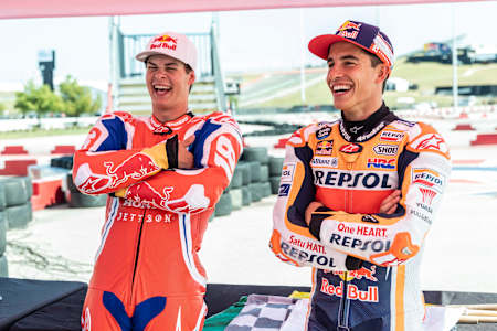 Jett Lawrence and Marc Márquez talk after they ride pit bikes in Austin, Texas, USA.