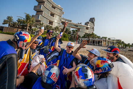 Wingsuit athletes celebrate during the Red Bull Ultimate Aerial Obstacle Course in Dubai, United Arab Emirates on October 17, 2025.