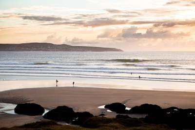 Godrevy's soft breaking waves are idea for learner surfers