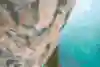 Sasha DiGiulian climbs a challenging 5.12c over water in Thailand.