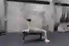 Brook Macdonald performs a single arm dumbbell press for Red Bull Fit 2019.