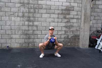 Brook Macdonald performs a goblet squat for Red Bull Fit 2019.