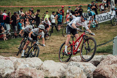 Mathias Fluckiger races against Nino Schurter at the XCC World Cup race in Les Gets, France.