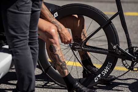 Patrick Seabase changes the rear tyre of his BMC Roadmachine during his unBRAKEable challenge in Switzerland.