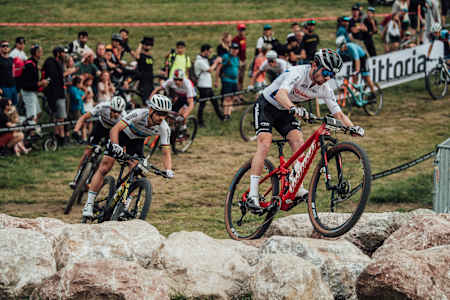 Mathias Fluckiger races against Nino Schurter at the XCC World Cup race in Les Gets, France.