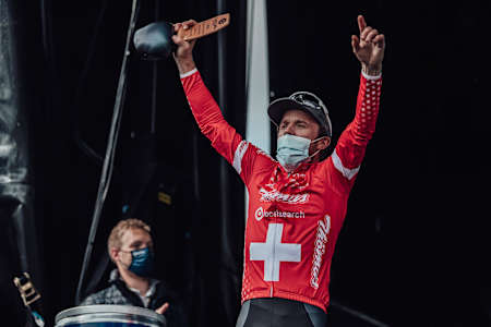 Mathias Flückiger as seen accepting the trophy for winning the 2021 UCI XCO World Cup round in Les Gets, France.