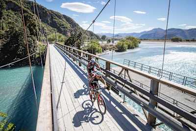 Competitors race on a bridge at Red Bull Defiance in Wanaka, New Zealand on January 20, 2018.