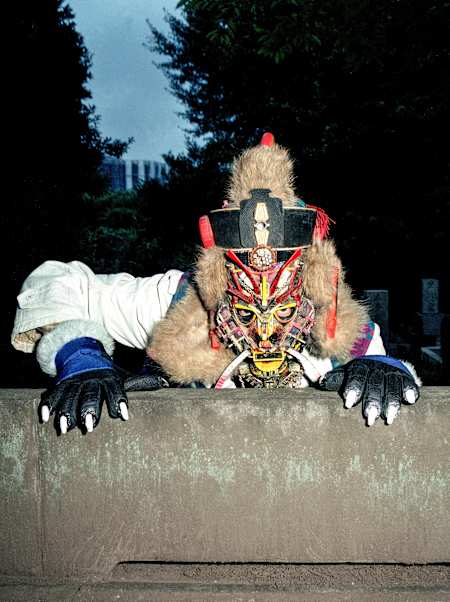 The artist transformed garbage into elaborate costumes and masks that he used to create characters like Crux the Monk.