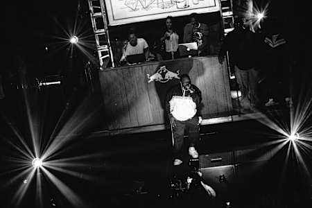 A photo of Just Blaze, Young Guru & Raekwon performing at Red Bull Music Academy Culture Clash in New York, 2013.