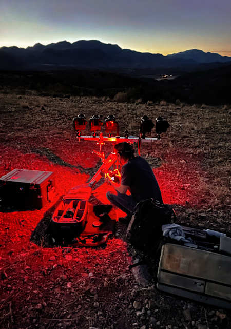 Photographer Dustin Snipes preparing his photography gear.