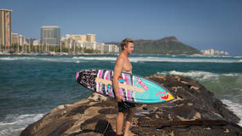 A surfer in Hawaii during filming of No Contest Off Tour