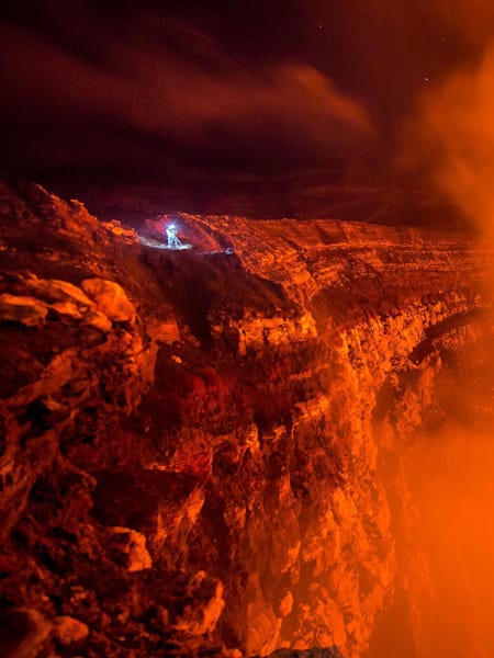 Climber heads into the boiling lava lake of Benbow Volcano