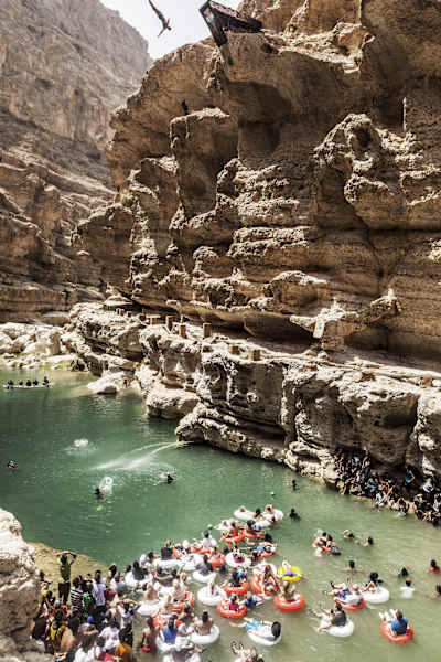 Michal Navratil of the Czech Republic dives from the 27.5 metre platform during the seventh and final stop of the Red Bull Cliff Diving World Series, Wadi Shab, Oman