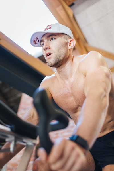 HYROX pro athlete Jake Dearden training on an indoor bike
