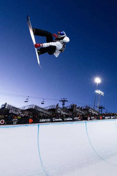 In 2025, Scotty James performs an aerial trick at the Laax Open snowboarding event in Laax, Switzerland.