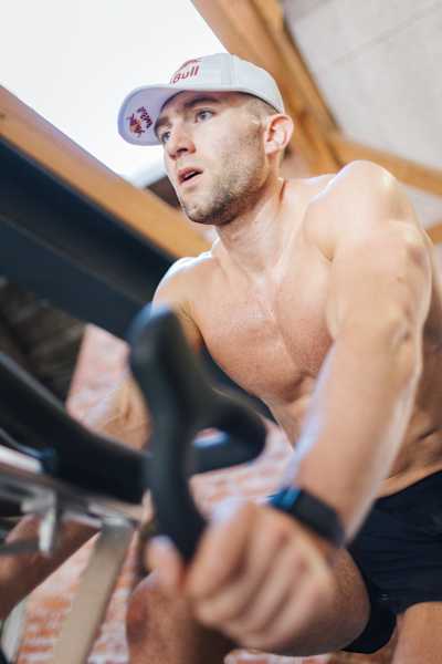 HYROX pro athlete Jake Dearden training on an indoor bike