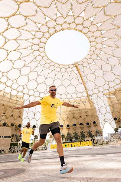 Participants bring excitement to the 2024 Wings for Life World Run at Expo Village in Dubai, running under the iconic dome structure