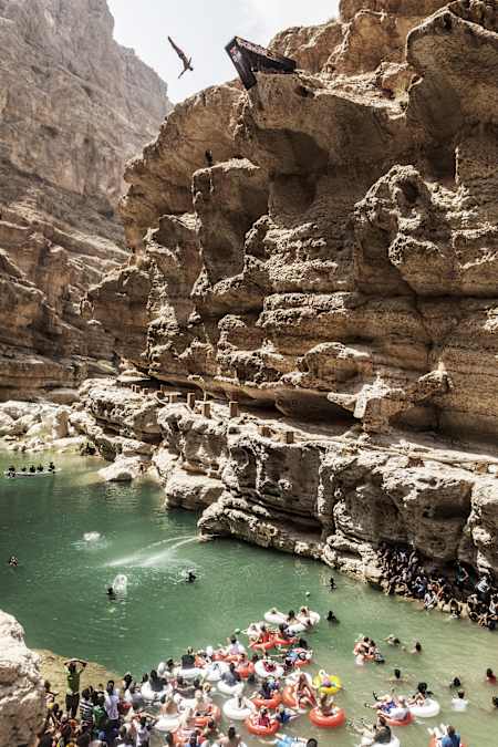 Michal Navratil of the Czech Republic dives from the 27.5 metre platform during the seventh and final stop of the Red Bull Cliff Diving World Series, Wadi Shab, Oman