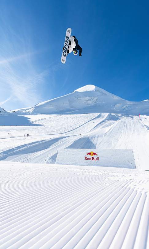 In September 2025, Ian Matteoli catches breathtaking airtime over a Red Bull obstacle during the Red Bull Performance camp in the stunning snowy landscape of Saas-Fee, Switzerland