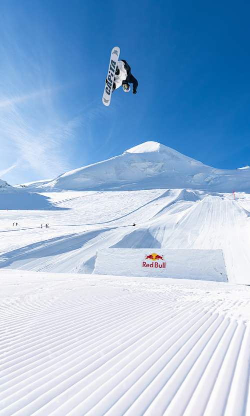 In September 2025, Ian Matteoli catches breathtaking airtime over a Red Bull obstacle during the Red Bull Performance camp in the stunning snowy landscape of Saas-Fee, Switzerland