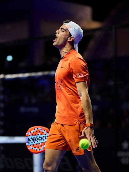 Juan Lebrón Chincoa, sporting Red Bull on his sleeve, commands action during the 2026 semi finals of Cancun Premier Padel P2 in Mexico, with vibrant energy on the court