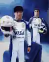 VCARB drivers Yuki Tsunoda and Isack Hadjar model the new team kit and their race helmets