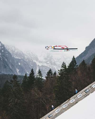 Daniel Tschofenig performs during the FIS Ski Jumping World Cup Finals at the Planica Skiflying Hill in Ratece, Slovenia on March 28, 2025.