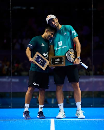 Federico Chingotto and Alejandro Galán at the Premier Padel GNP Major Acapulco in Mexico, holding runner-up trophies on court.