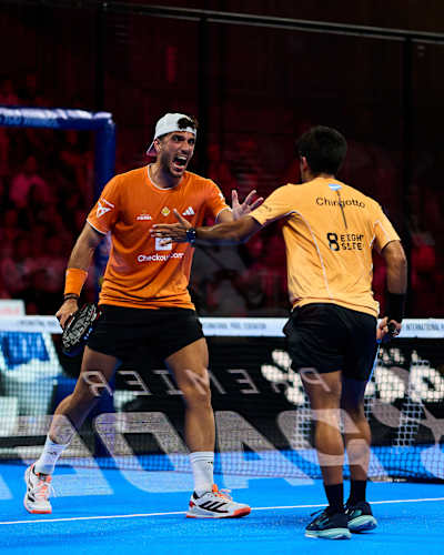 Alejandro Galán and Federico Chingotto high-five in action during the Miami Premier Padel P1 finals in the United States in March 2026.