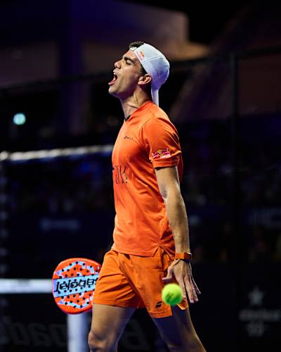 Juan Lebrón Chincoa, sporting Red Bull on his sleeve, commands action during the 2026 semi finals of Cancun Premier Padel P2 in Mexico, with vibrant energy on the court