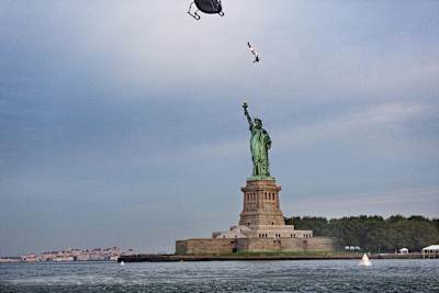 Orlando Duque completes a flying back in front of the Statue of Liberty in New York City.